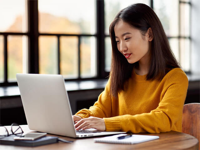 A lady working on a laptop